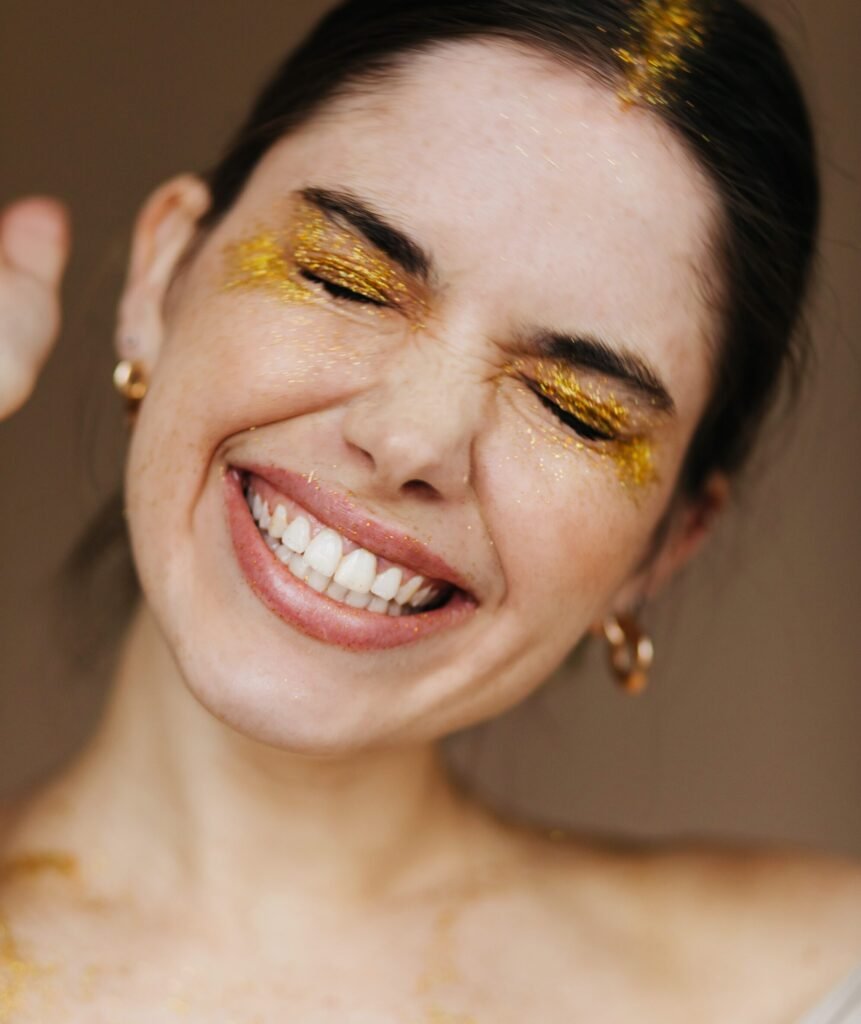 close up portrait gorgeous female model golden accessories attractive brunette girl laughing with eyes closed scaled e1789986039161
