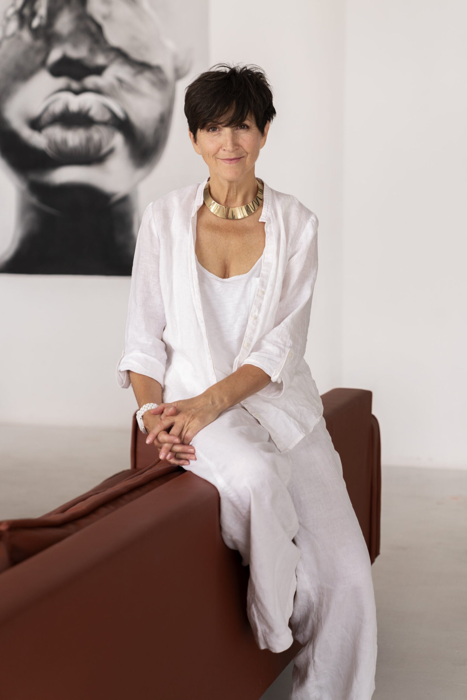 full shot rich woman sitting home scaled