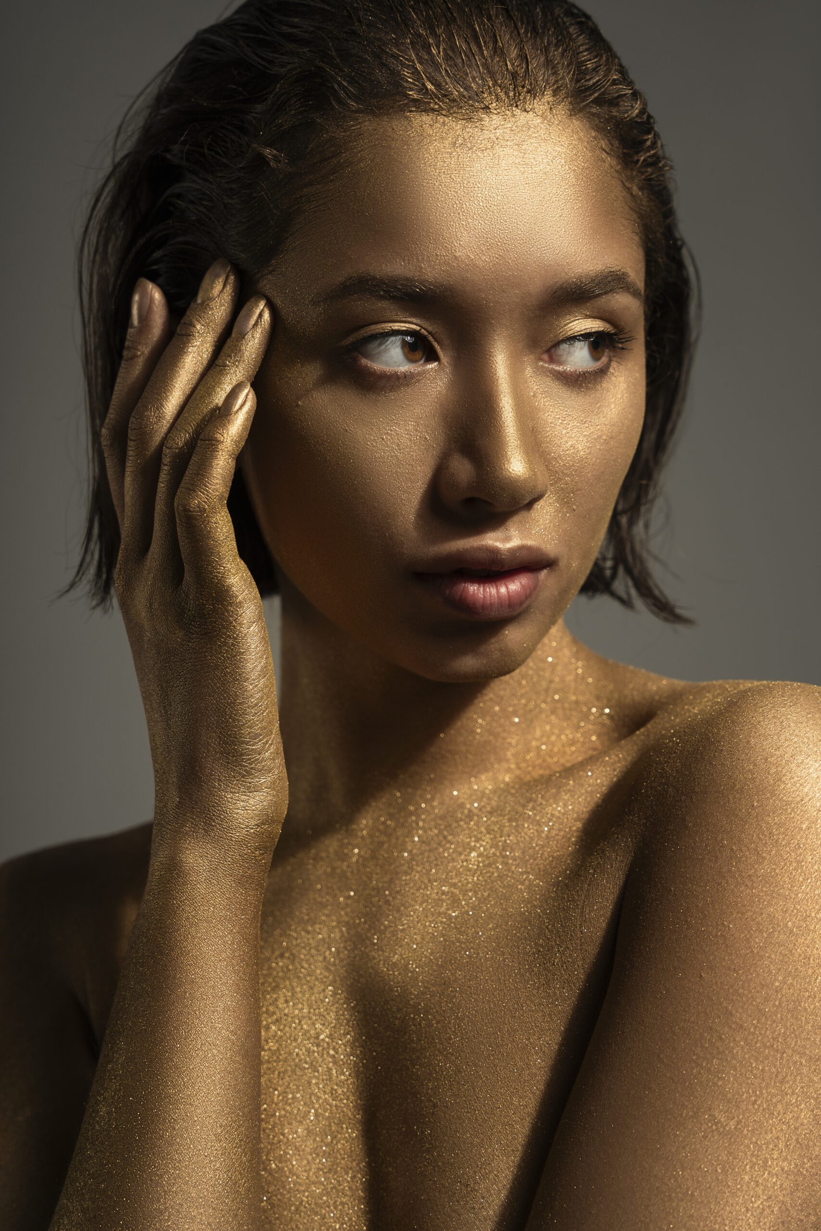 medium shot woman posing with gold body painting 2 scaled