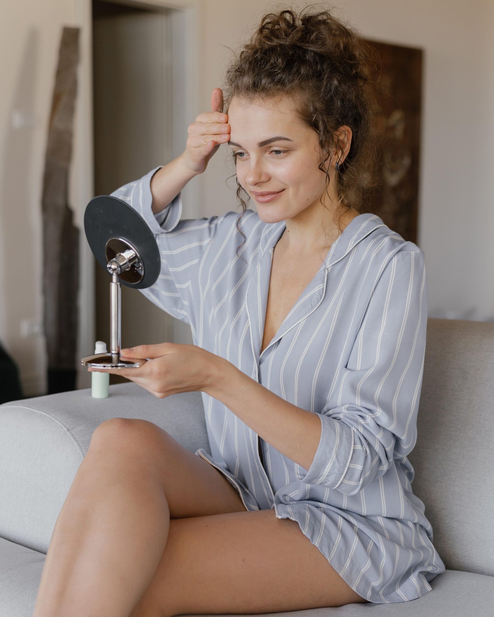 woman home looking mirror scaled
