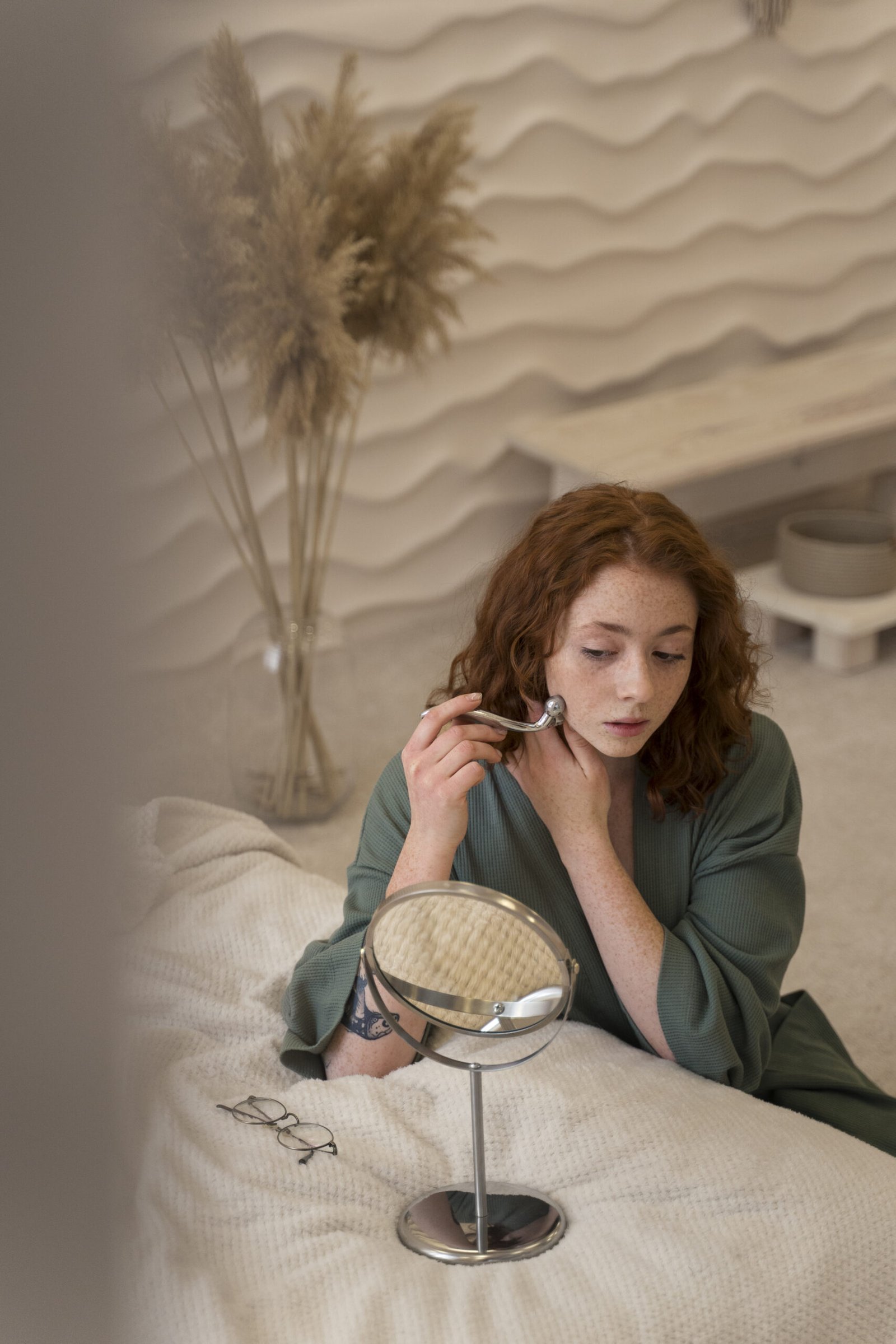 woman using face roller her beauty routine scaled
